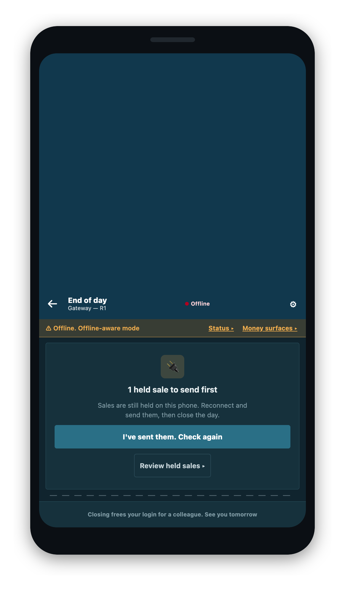 The end-of-day screen blocked because a sale is still held on the phone.