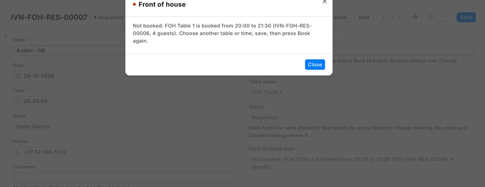 A second booking for the same table at 20:30, refused: the message names the first booking and its time